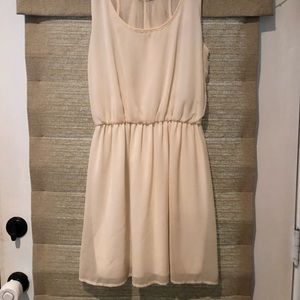 Bow accented cream dress